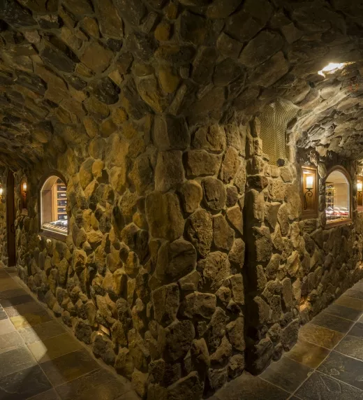Wine Cellar walls covered in stone.