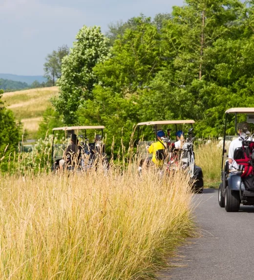 Golf carts driving to their next hole at Cascades Golf Course at Crystal Springs Resort
