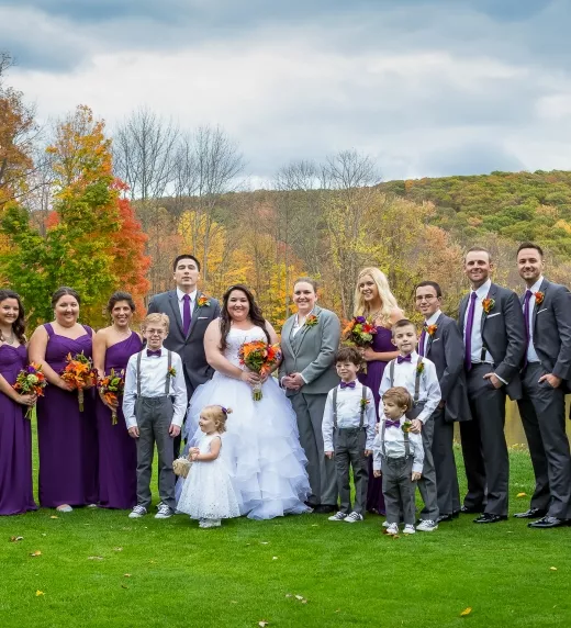 Wedding party with brides and their families