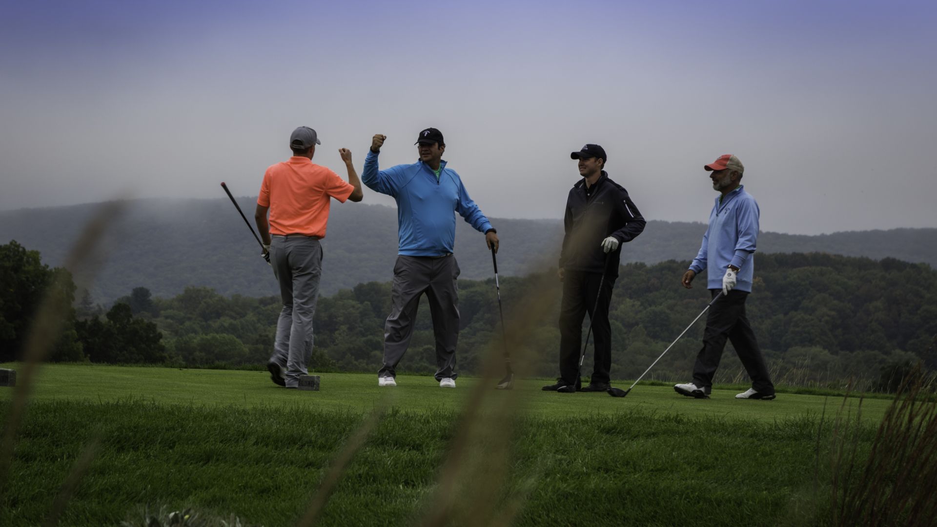 A happy foursome of golfers.