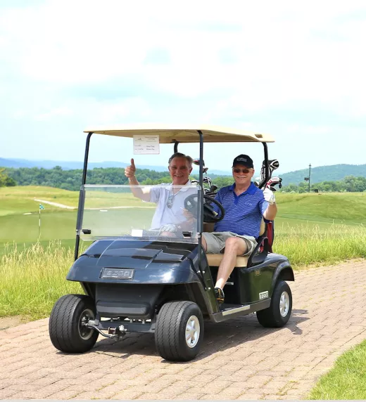 A convoy of guys on golf carts at Ballyowen Golf Club