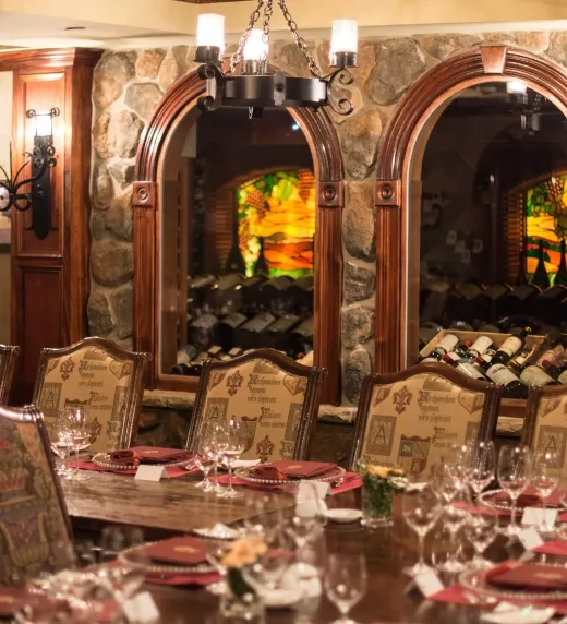 Wine Cellar Bordeaux Room set up long wooden dinner tables.