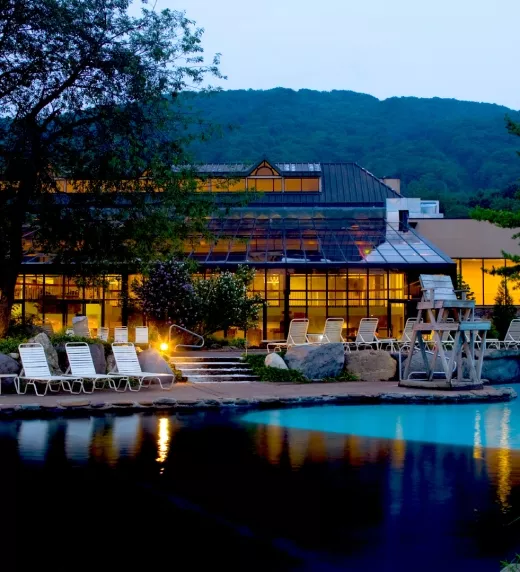 Nighttime view of Minerals Hotel pool at Crystal Springs Resort in NJ