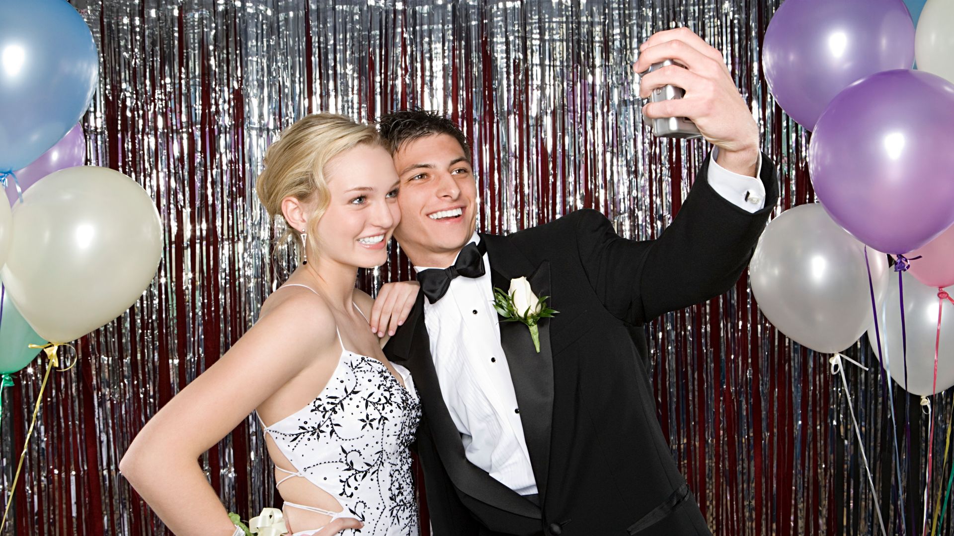 Couple Taking Selfie at Prom