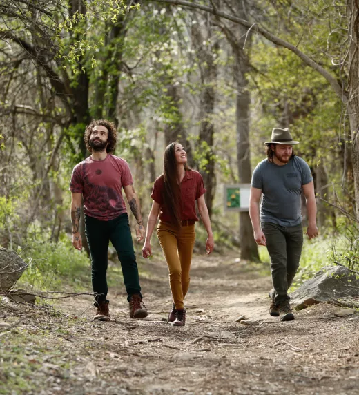 Three people hiking at Wild Turkey Nature Trail