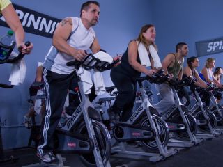 Seven people taking part in a spin class