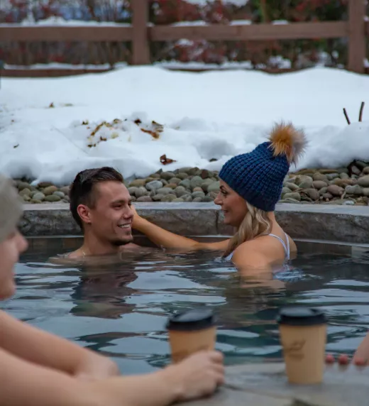 Adults enjoying the snow pool at Grand Cascades Lodge of Crystal Springs Resort in NJ