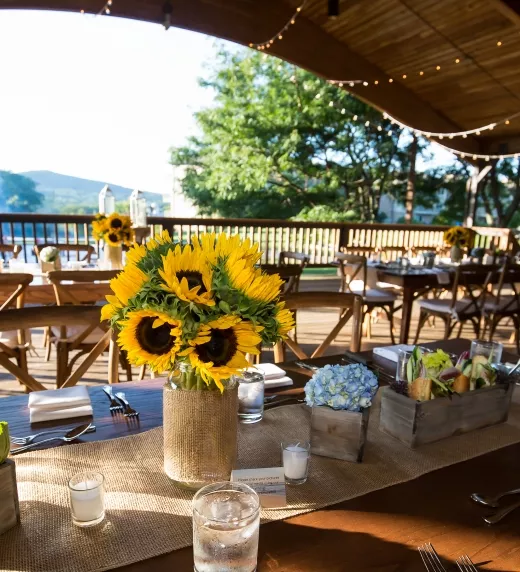 Sweetgrass Pavillion wedding set up with sunflower centerpieces