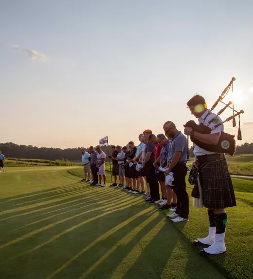 Golfers and Marching band lined up on Ballyowen Golf Course