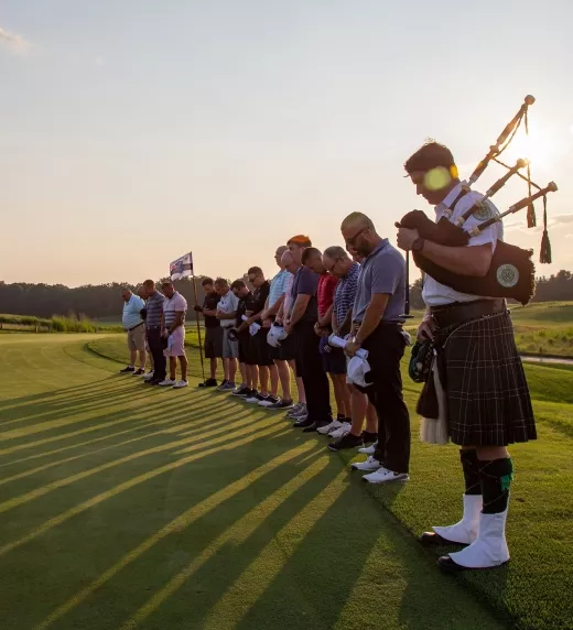 Golfers and Marching band lined up on Ballyowen Golf Course