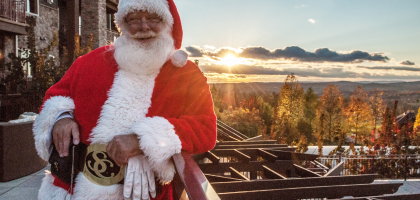 Santa in front of scenic view at Grand Cascades Lodge at Crystal Springs Resort NJ