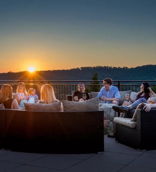 Friends spending time by the firepit at a resort close to NYC