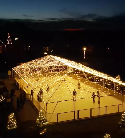 Glice skating rink at night time.