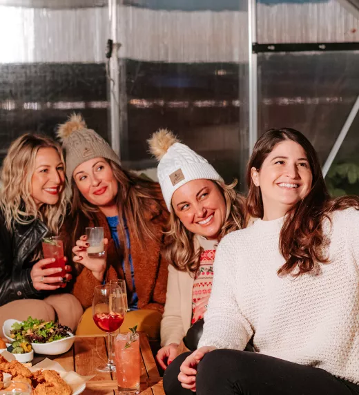 Group of girlfriends taking selfie in Champagne Chalet